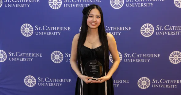 Victoria Lo with the Dean of Students award