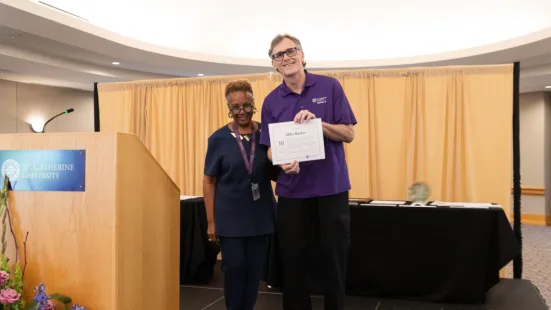 President Evans and staff awardee Michael Baxter