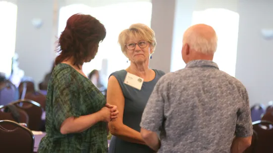 Three people in conversation