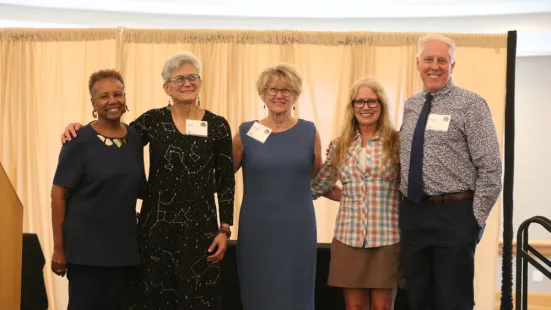 President Evans poses with 2026 professors emeriti