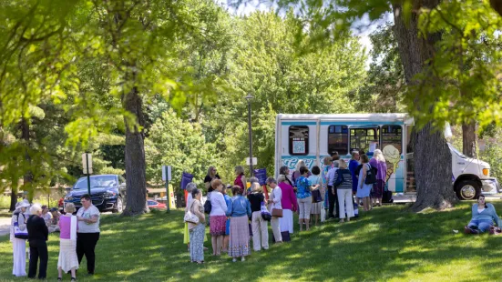 Alumni line up for an ice cream truck parked on campus.
