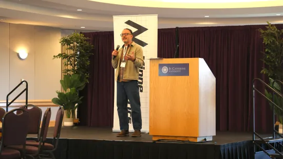 Jim Lesch of the non-profit The Food Group speaks at the student data challenge by MinneAnalytics.