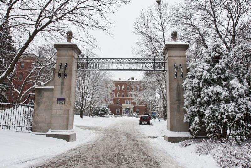 St. Catherine University campus gate covered by snow