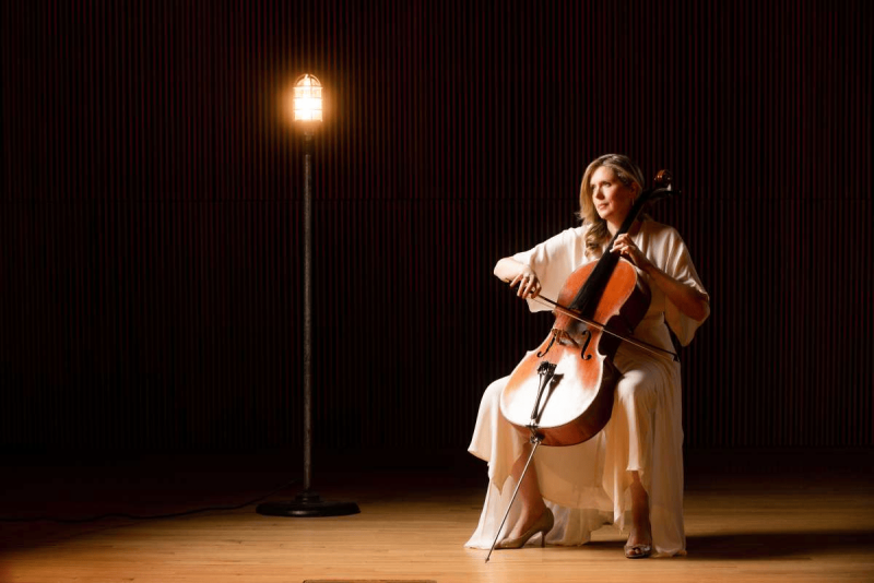 mairi playing cello looking off camera