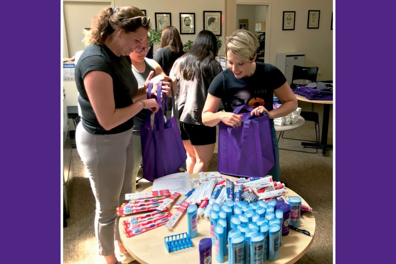 Physical therapy students putting together "welcome home bags."