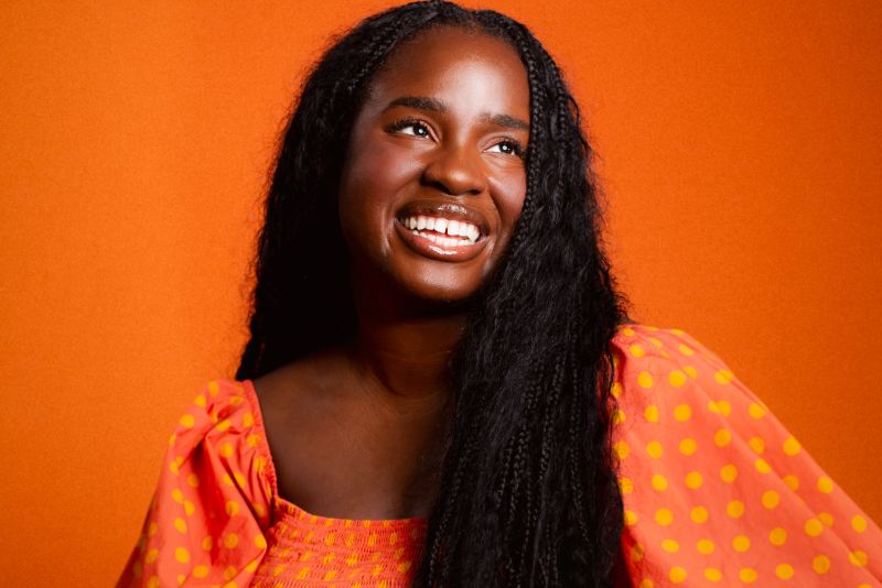 Headshot of Anna Gifty Opoku-Agyeman, a Ghanaian-American researcher, speaker, and author. She appears smiling, shoulders and head visible, facing forward.