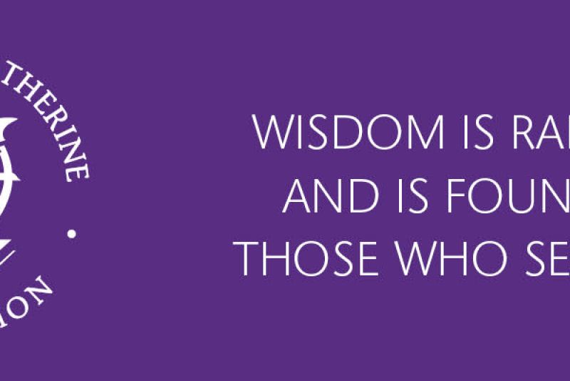 Purple banner with the text “Feast of St. Catherine Celebration” surrounding a white emblem of a quill over a wheel and book. To the right, white text reads: “Wisdom is radiant and is found by those who seek her.”