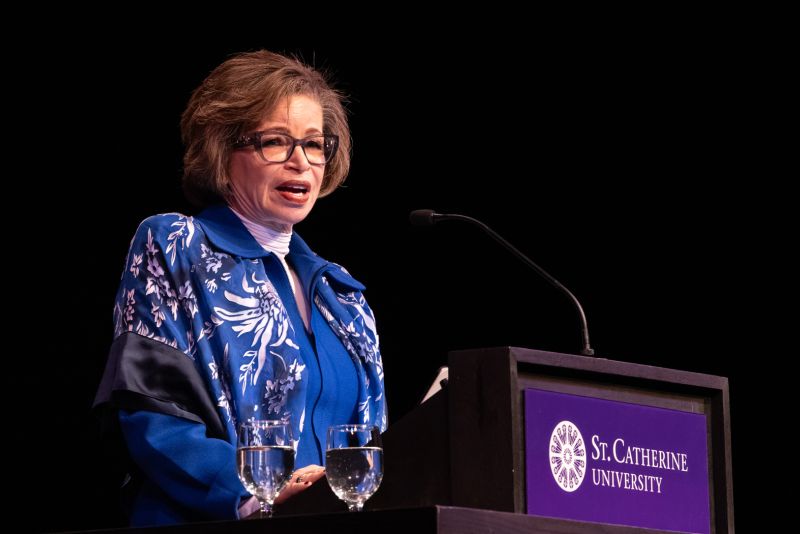 Valerie Jarrett speaks at a podium in The O'Shaughnessy.