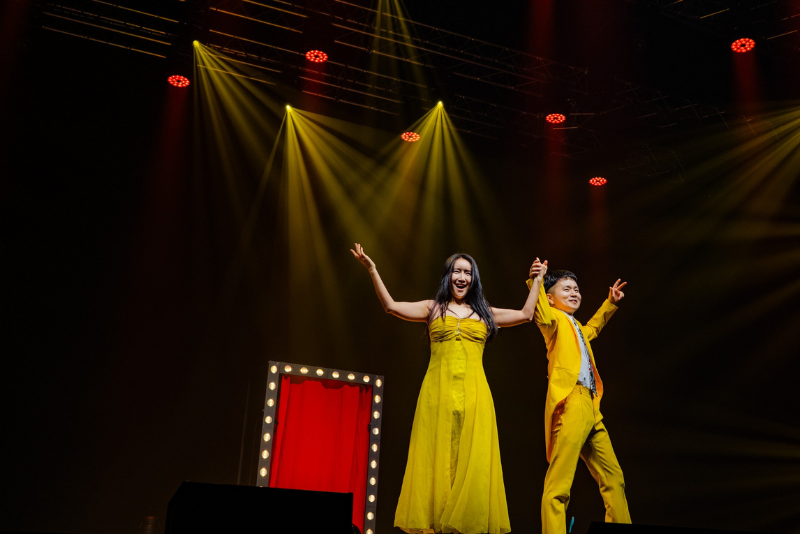 Jeki Yoo and his wife on stage during magic show