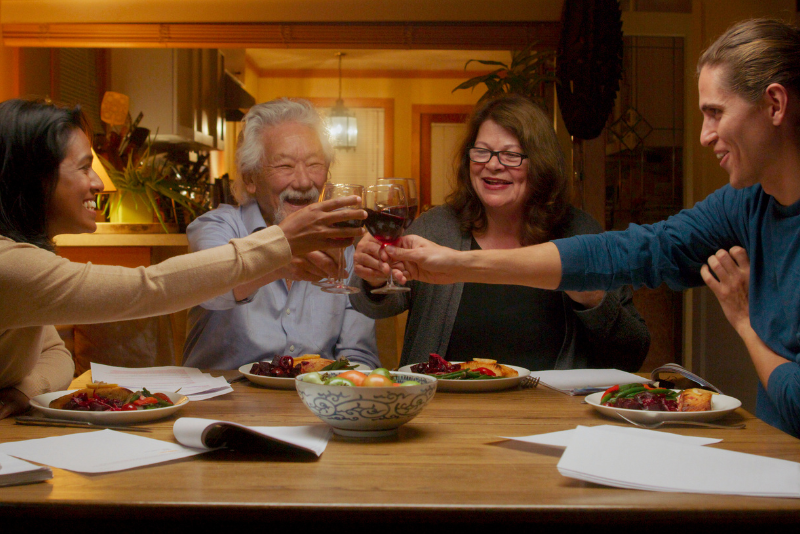 4 people seated around a dinner table 
