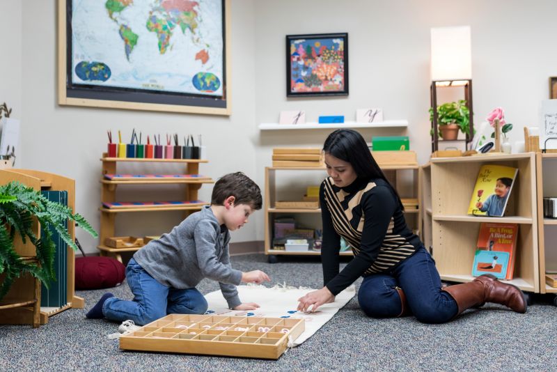 Montessori classroom image with student and teacher
