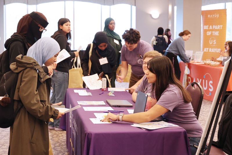 Students stop by a table during the career fair.