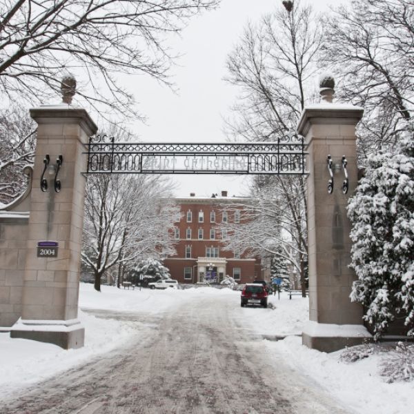 St. Catherine University campus gate covered by snow