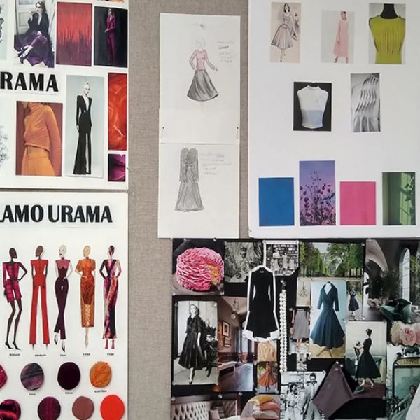 Wall covered with fashion design mood boards featuring dress sketches, fabric swatches, color palettes, and inspiration photos labeled “Glamourama.”