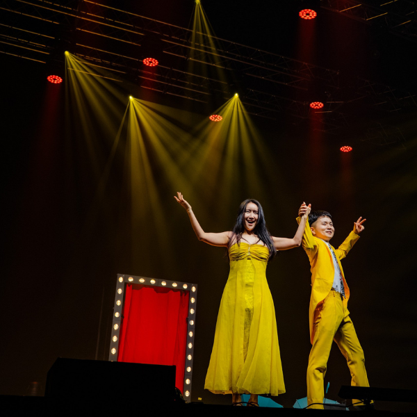 Jeki Yoo and his wife on stage during magic show