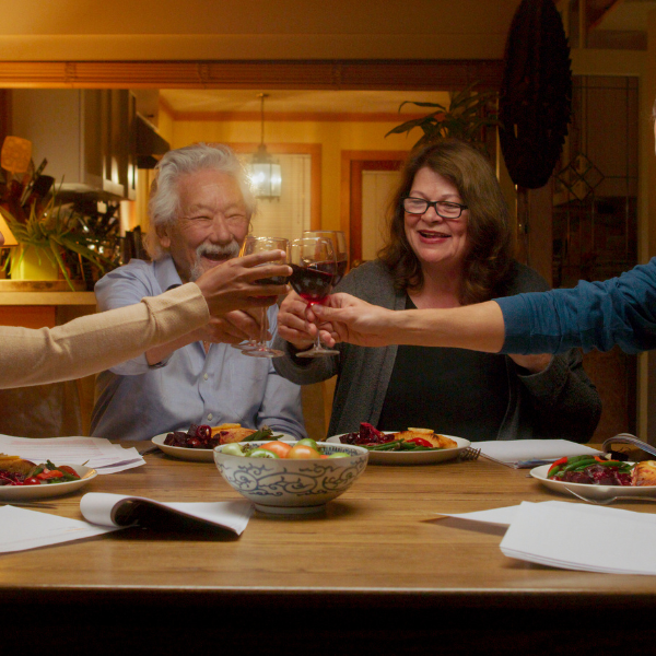 4 people seated around a dinner table 