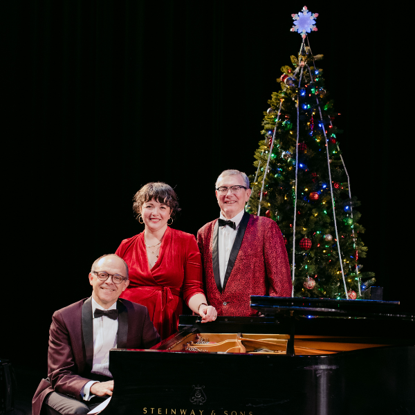 Kevin Kling & Friends at piano with Christmas tree