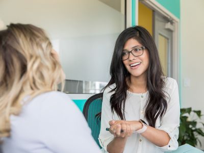 Social worker in discussion with patient
