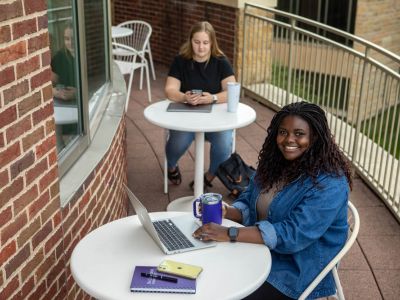 Students working during break time out on the Coeur de Catherine's open air balcony space