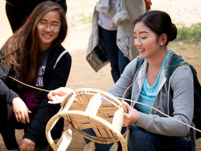 Two female students doing a craft abroad