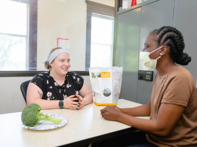 Nutrition science student consulting with patient