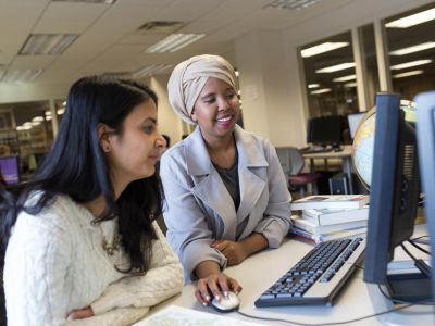 Two students working together at a computer