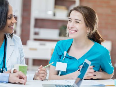 Nurses consulting at a workstation