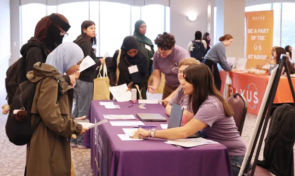 Students stop by a table during the career fair.