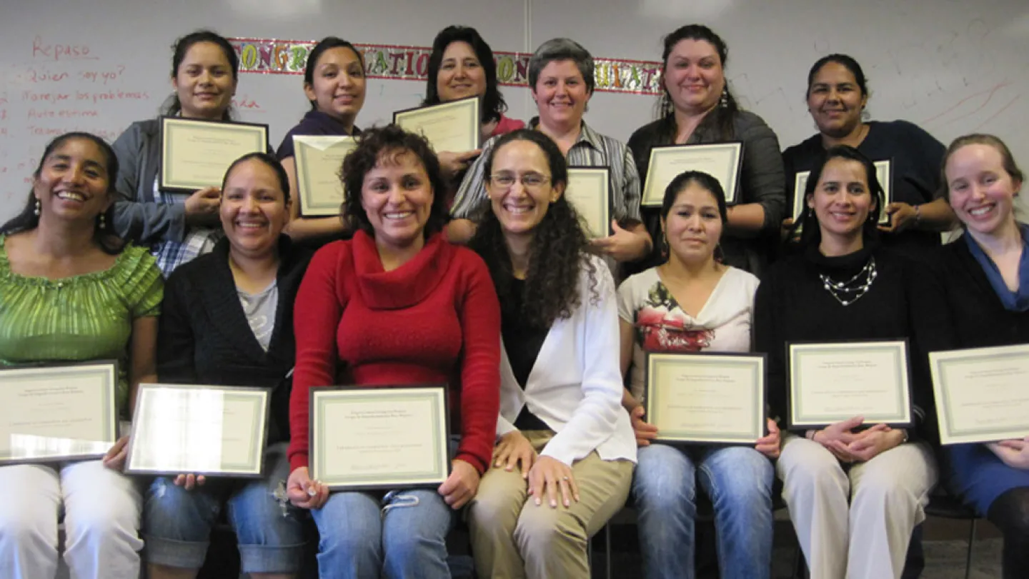 Graduation day: Assistant Professor Catherine Marrs Fuchsel (center, in glasses) with her April 2012 support group. Photo provided by Catherine Marrs Fuchsel.