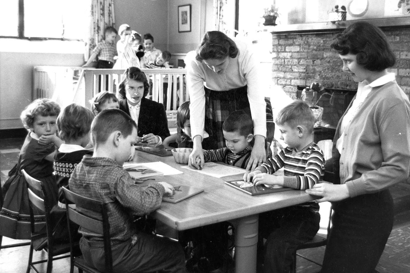 Children learning with teachers at Montessori school