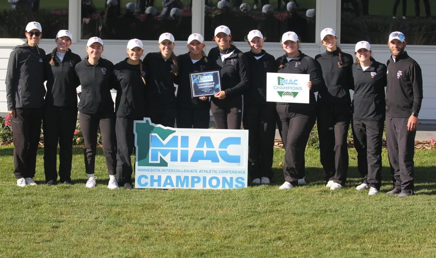 The golf team stands with a banner that says "MIAC Champions"