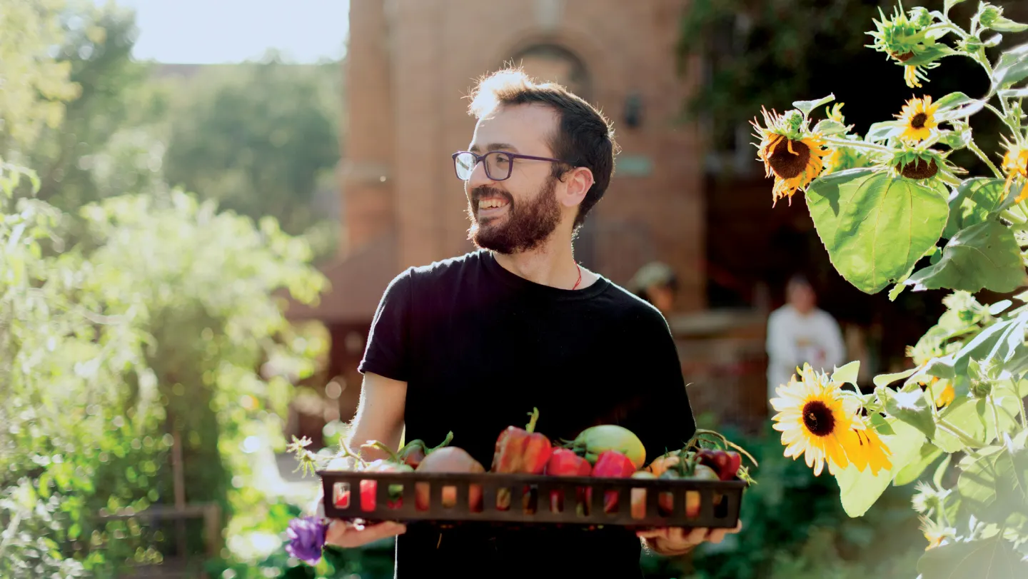 Zach Ludwig in the CSJ Community Gardens