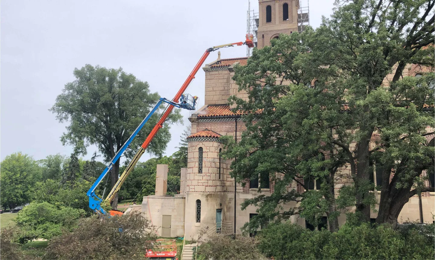 Construction cranes at work on Our Lady of Victory Chapel