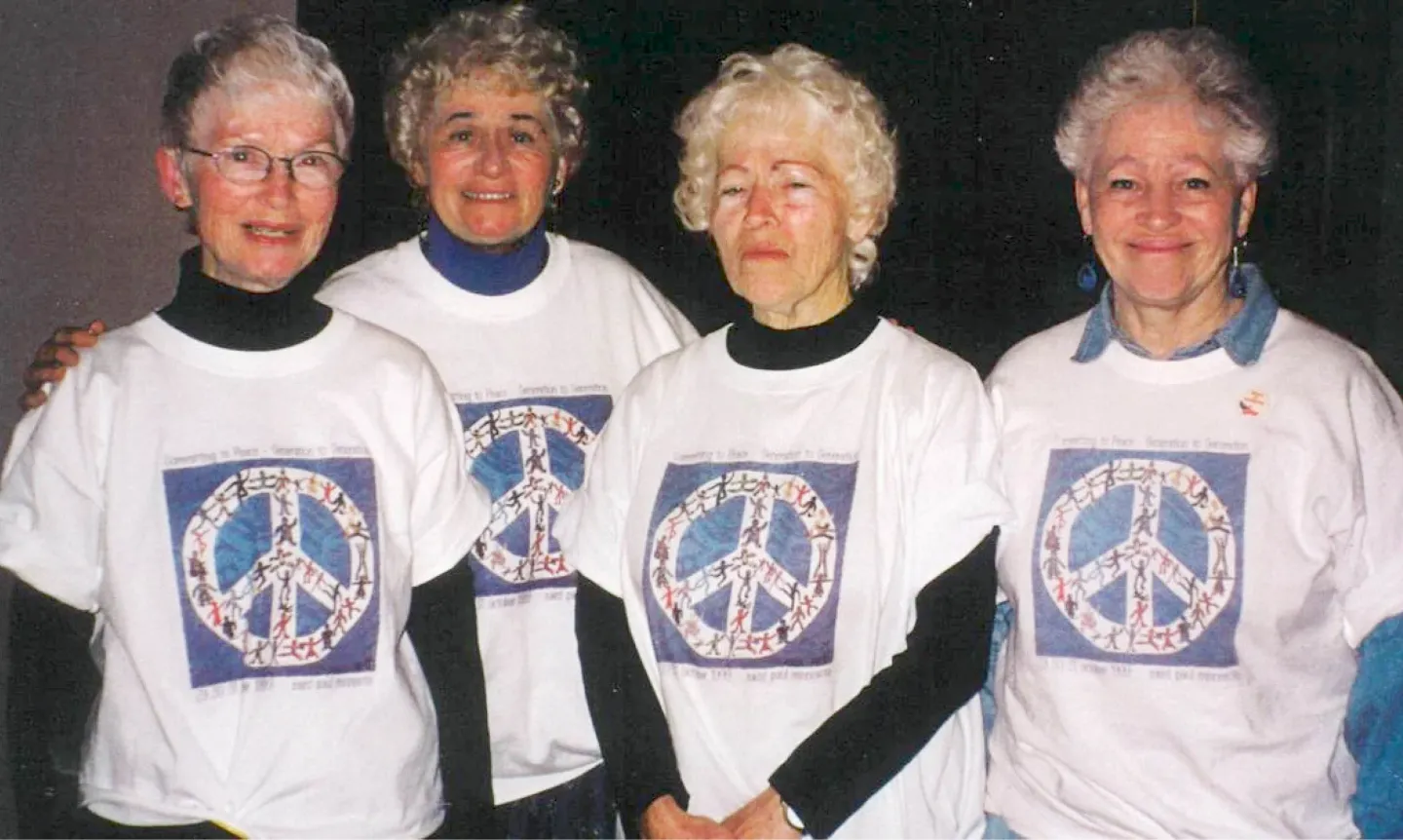 All four McDonald sisters wear shirts with peace signs