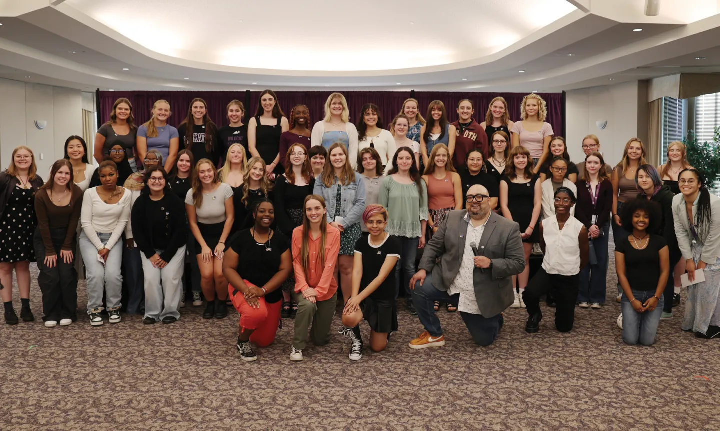 The new group of Antonian Honors students stand together inside the Ballroom.