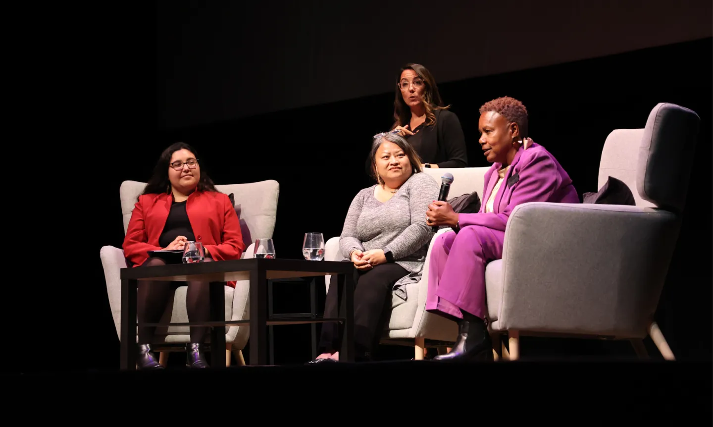 Josi Aguilera ’25, Kabo Yang MAOL’09, and President Evans speak on a panel