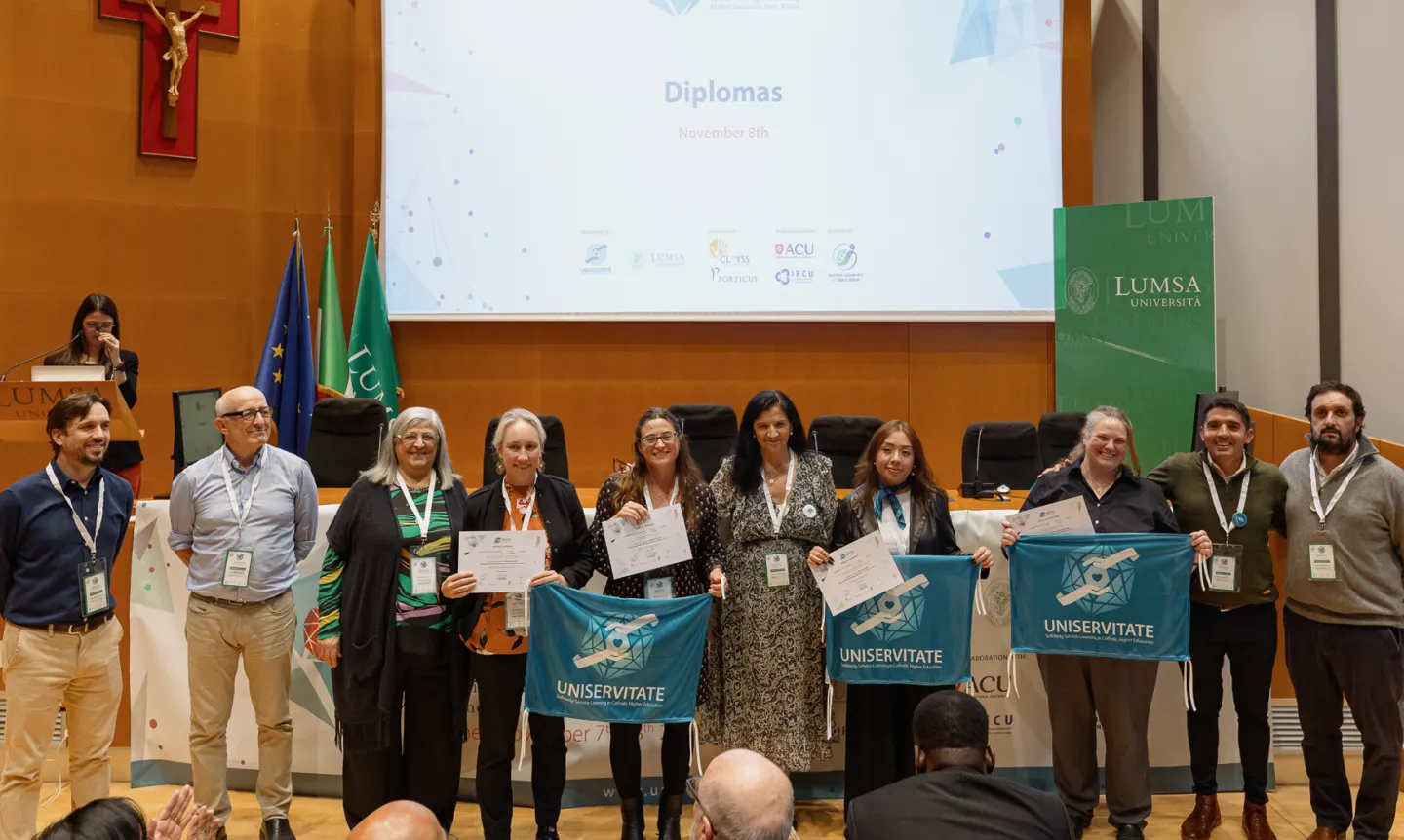 St. Kate's team members receive Uniservitate certificates