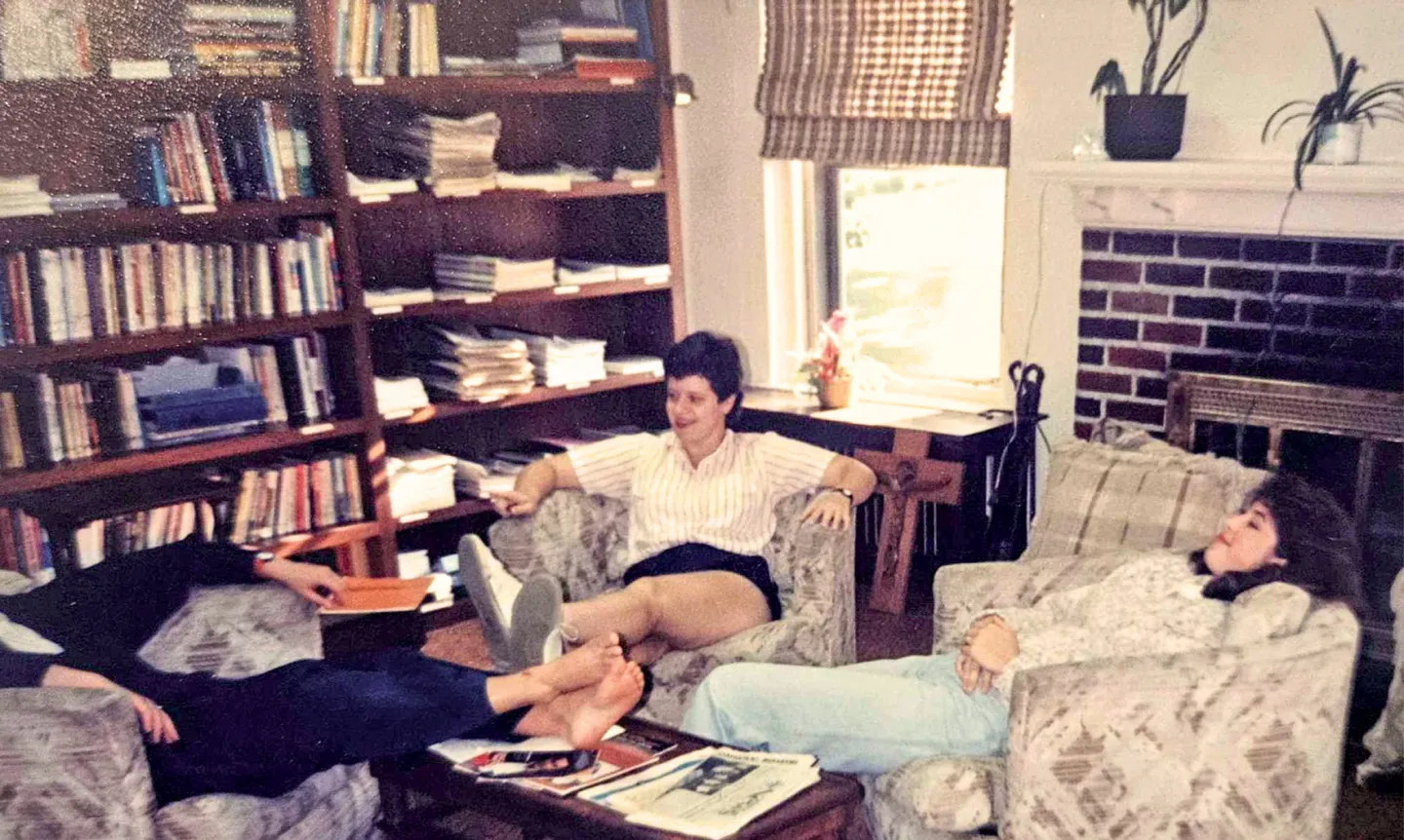 Three students sitting in the lounge of the Chapel ministry.