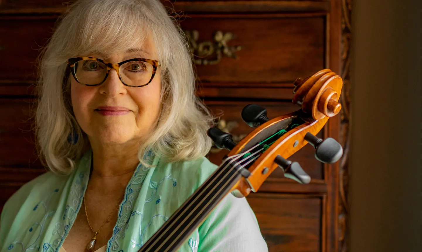 Janet Horvath poses with her cello