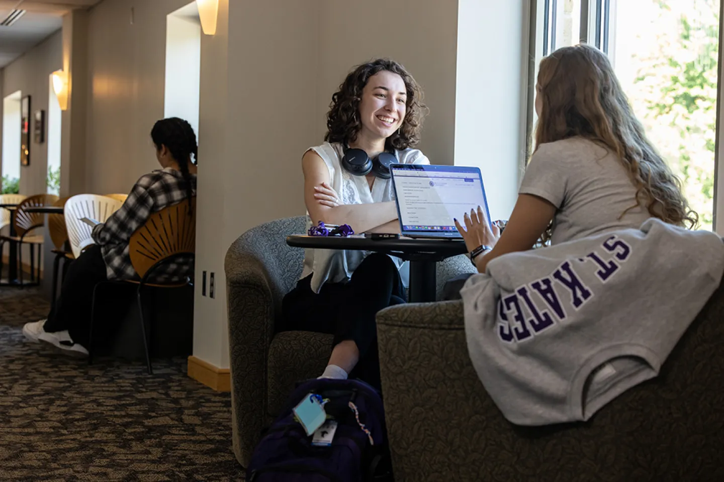 two students collaborating on computer