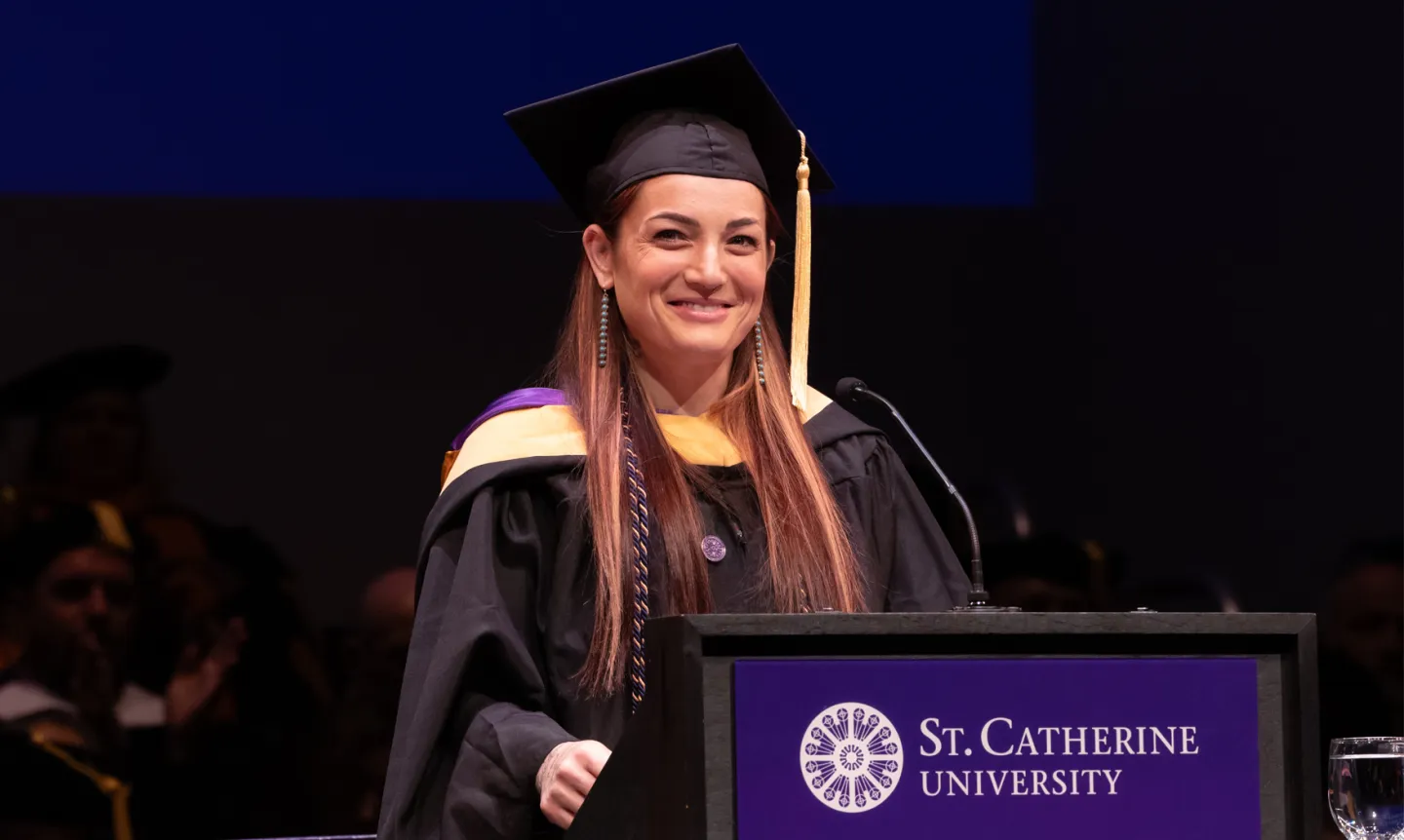 Amanda Sperling ’25, College for Adults Commencement speaker at the podium