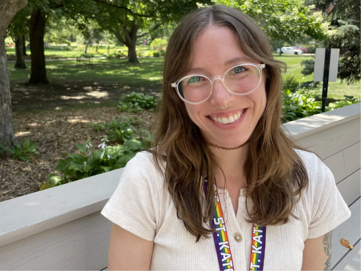 white woman with long brown hair and glasses