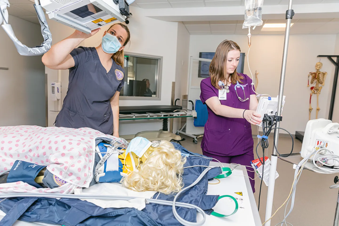 two nursing students performing simulation exercise