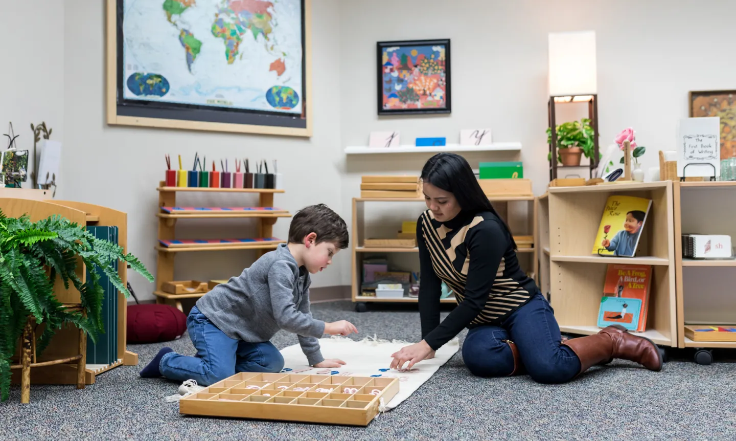 Montessori classroom image with student and teacher