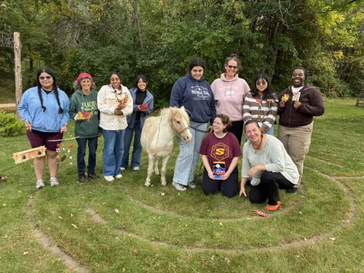Students and a horse in a labyrinth at Innisfree Farm 