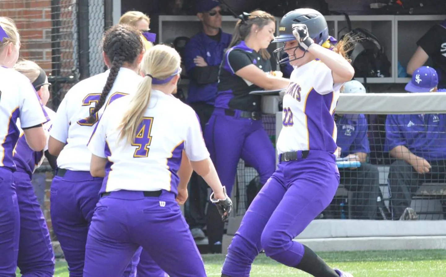 Megan Lindenfelser '18 hits home plate following a home run during the first game against St. Thomas Sunday, May 8, 2016. Photo by Matt Higgins, MIAC.